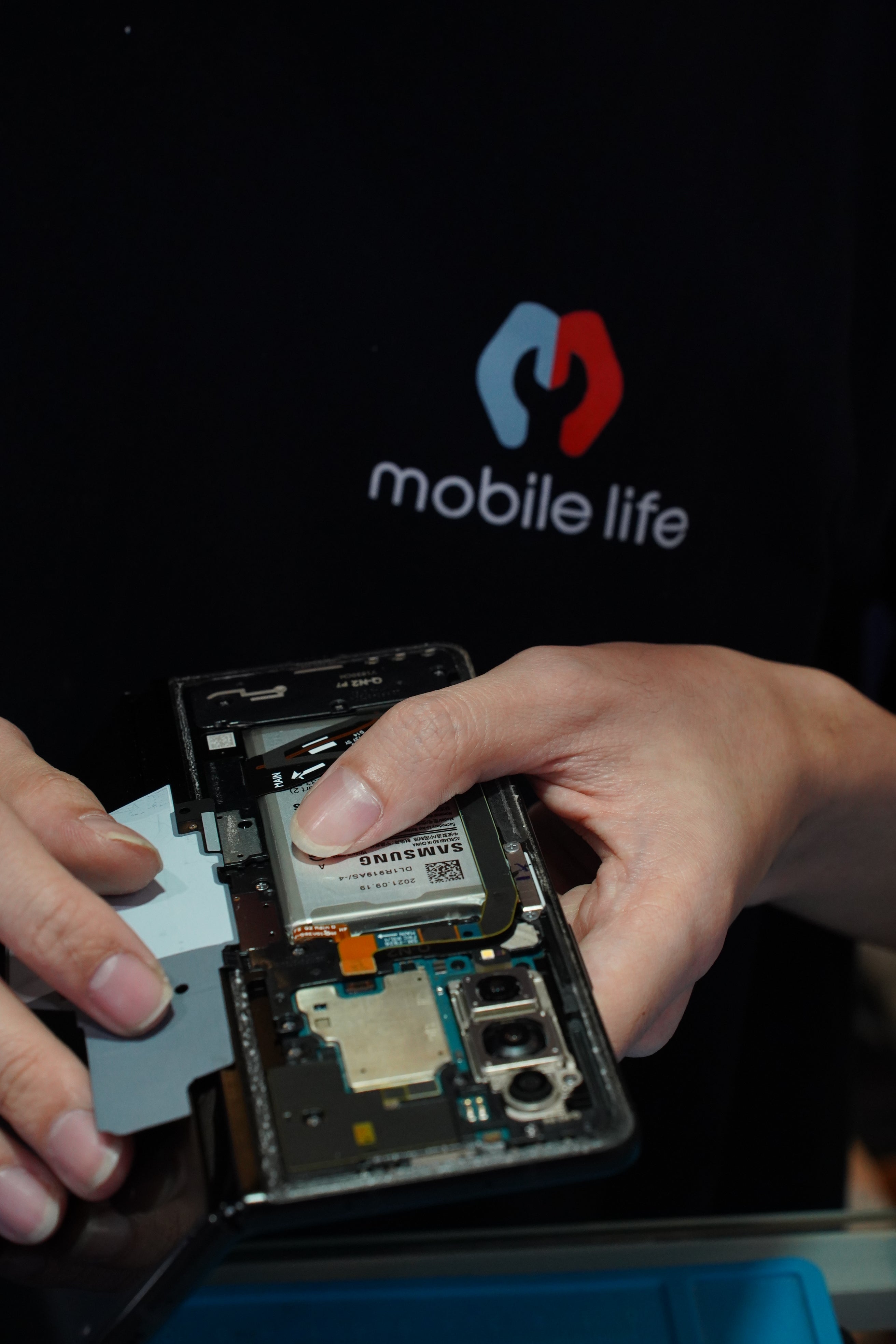 mobile repair technician fixing phone